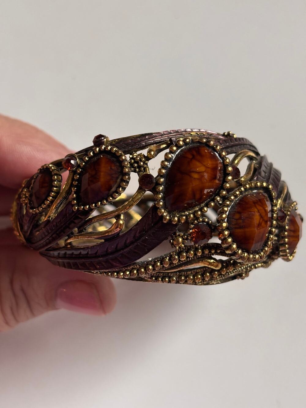 Vintage 7 inch gold tone clamp bracelet with faceted brown stones